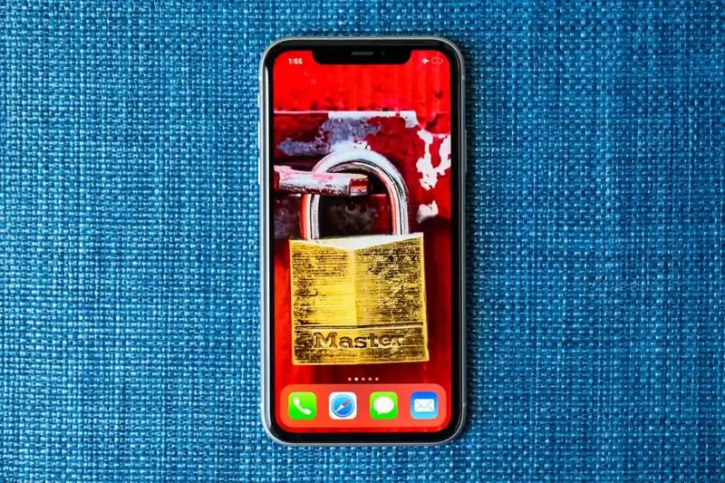 picture of a phone with a locker wallpaper representing protection from gift card scam fraud