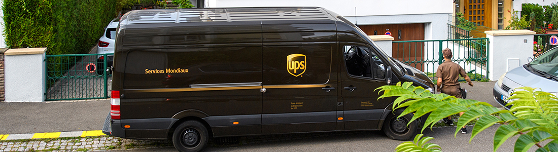 UPS delivery person dropping a package